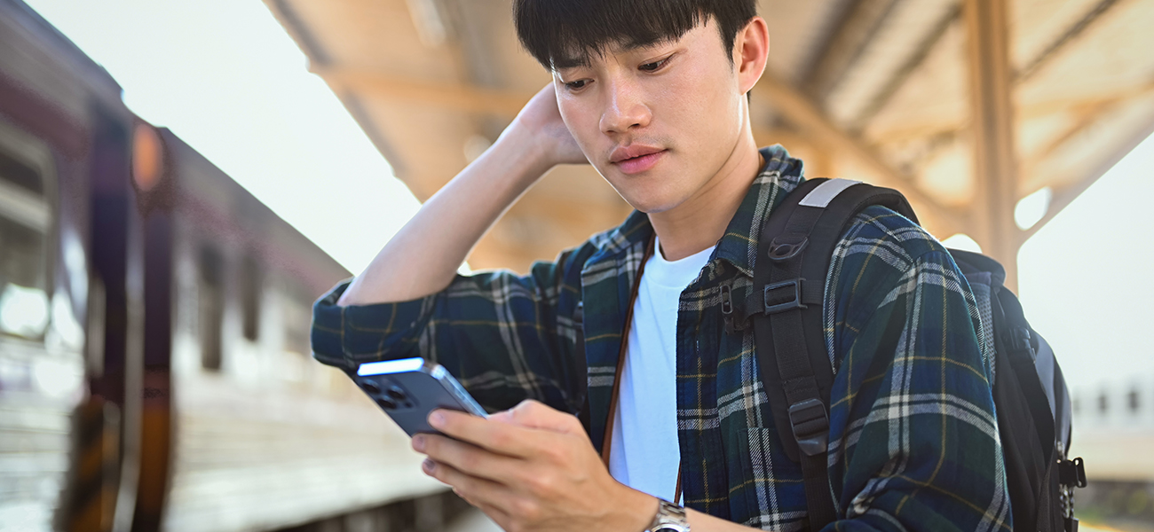 A worried man checks his social account on his phone