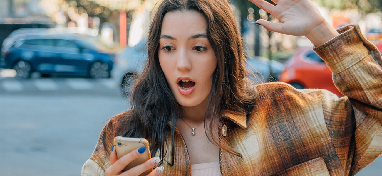 Student reviewing message on phone