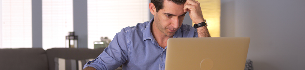 Staff member frustrated with laptop